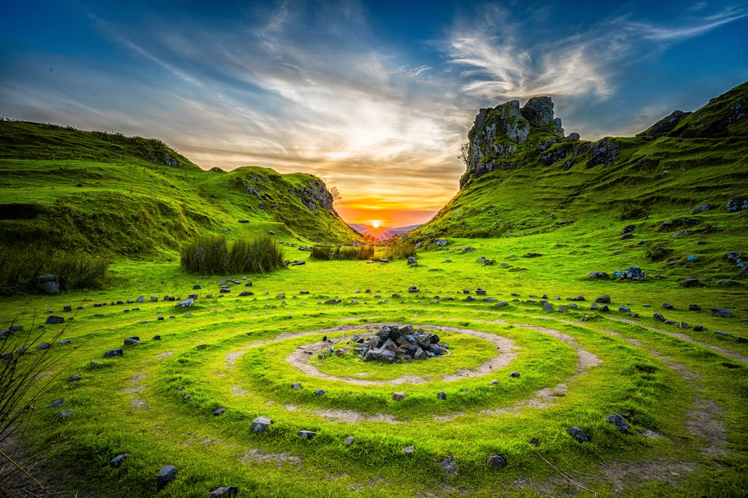 green-grass-field-during-sunset-rbcxo9au-u